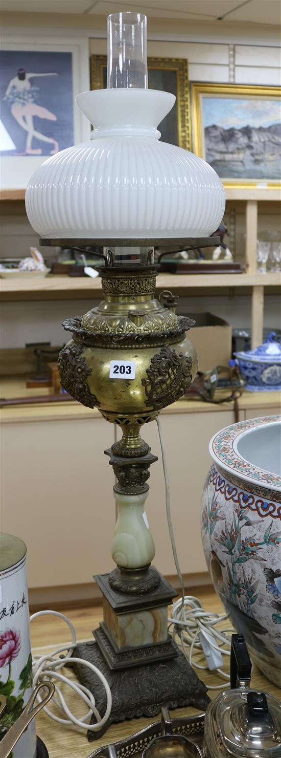 A brass and green onyx oil lamp height 95cm